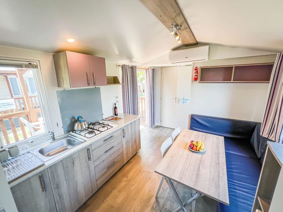 Comfort Mobile Home | Private kitchen | Fridge, stovetop, highchair, cookware/dishes/utensils