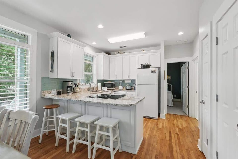 - Clean & inviting kitchen with bar stools ready for breakfast, snacks, or good conversation - Whip up something delicious with all the essentials right where you need them - Layout makes it easy to stay connected while you cook & relax nearby