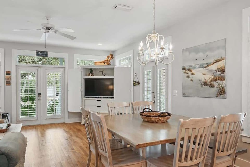 - Dining area with plenty of natural light & room for everyone at the table - Enjoy meals together while keeping the TV nearby for movie nights or background tunes - Surrounded by windows & doors, it’s a space that feels open & inviting all day