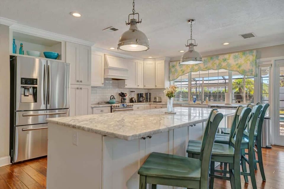 Grab a stool and stay a while! This stylish kitchen island is the heart of the home