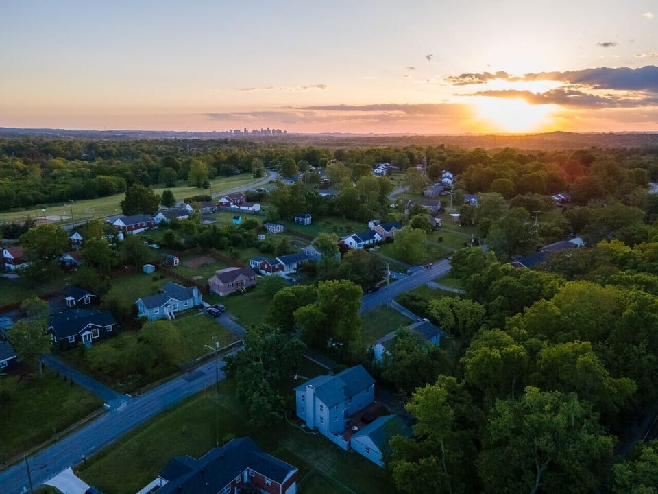 Stunning aerial sunset views showcasing the beautiful, lush green surroundings. 🌅