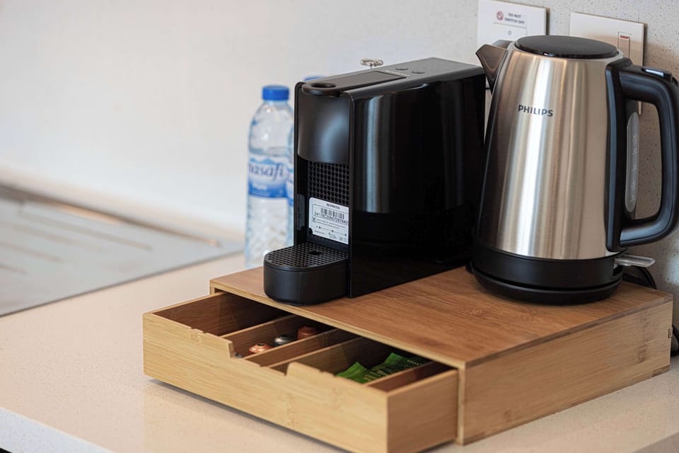 Start your day off right with a Nespresso machine, kettle, and a selection of complimentary coffee pods, tea bags, sugar, and more, all provided for your convenience.