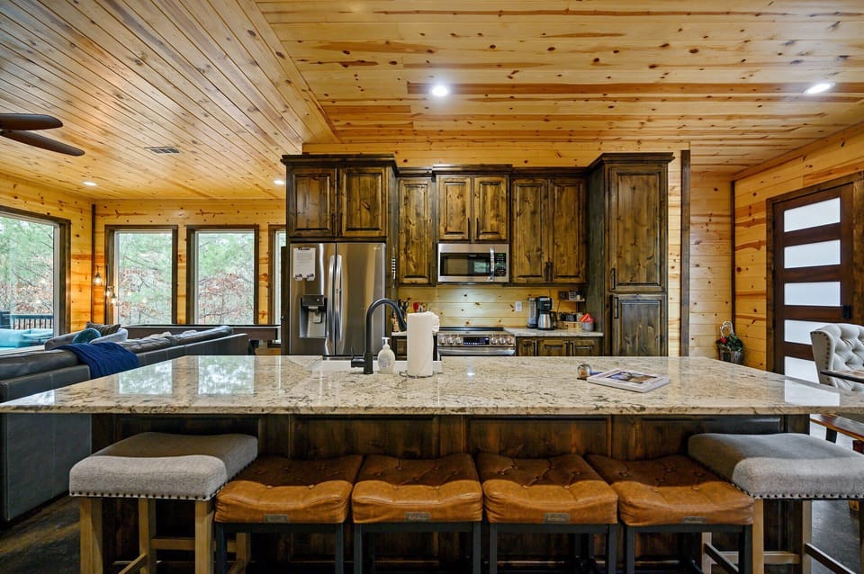 The chic, open kitchen offers ample space & all the comforts of home