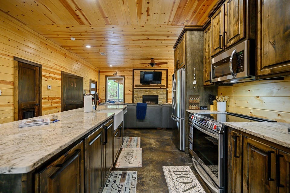The chic, open kitchen offers ample space & all the comforts of home