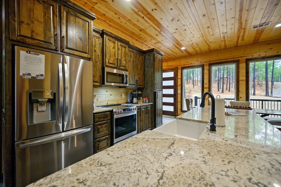 The chic, open kitchen offers ample space & all the comforts of home