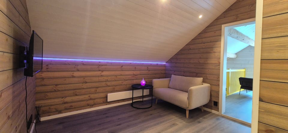 Deluxe Cabin no.2, 4 Bedrooms, Mountain View | Living area | TV, fireplace, heated floors