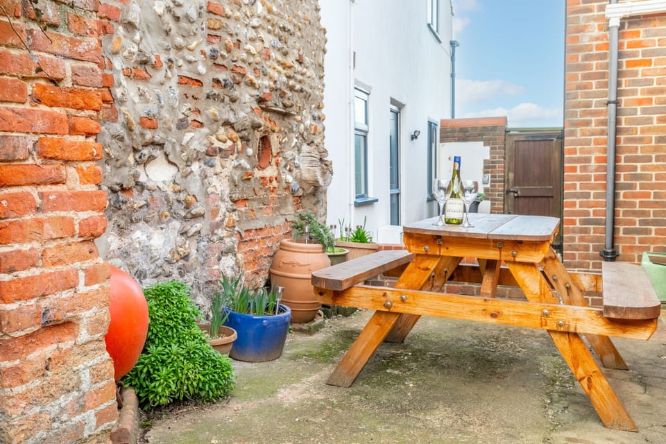 Picnic seating in the garden to catch the sun's rays