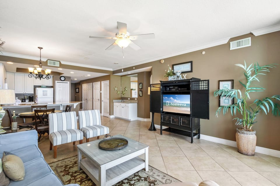 Deluxe Condo, 2 Bedrooms, Balcony, Beach View | Living room | 50-inch Smart TV with cable channels