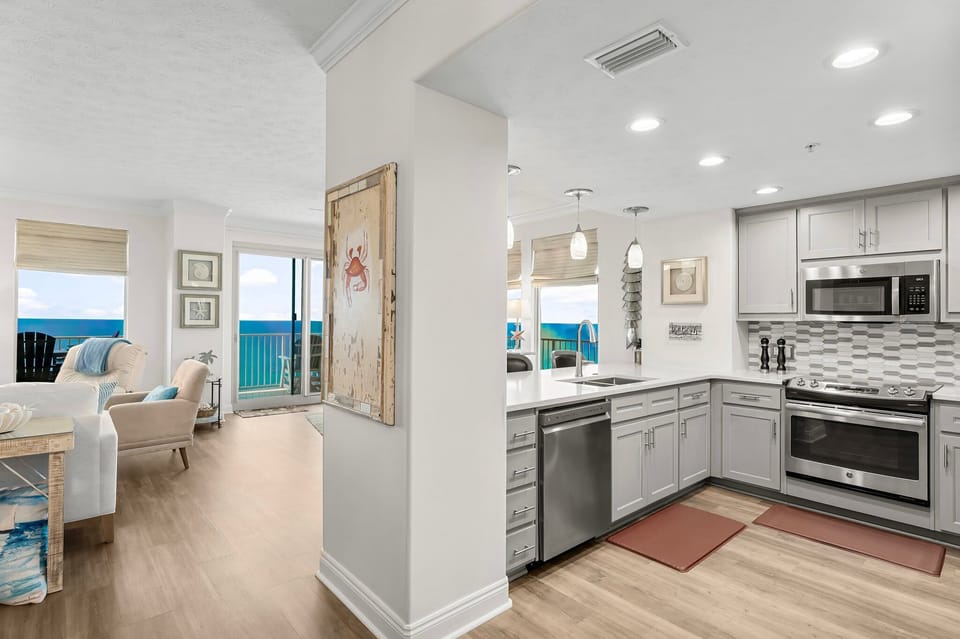 Modern kitchen and living area with ocean views and natural light