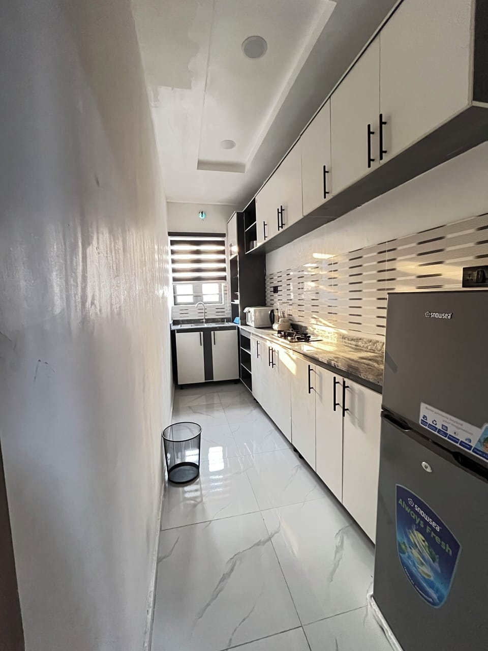 Mini-fridge, microwave, cookware/dishes/utensils
