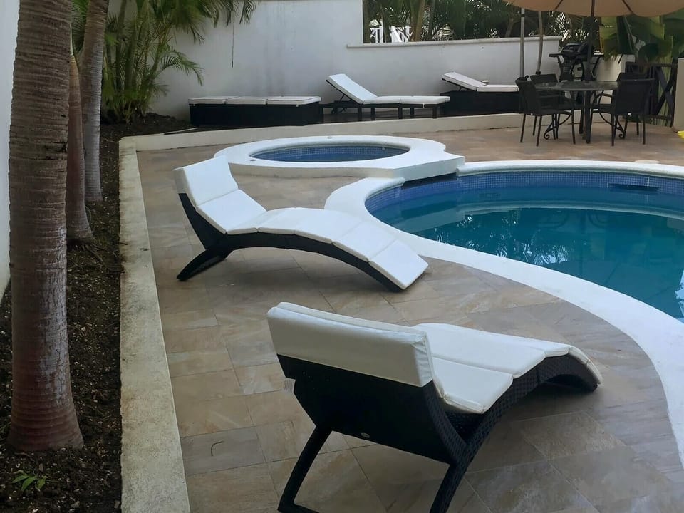 Large pool and spa by day, pure relaxation.