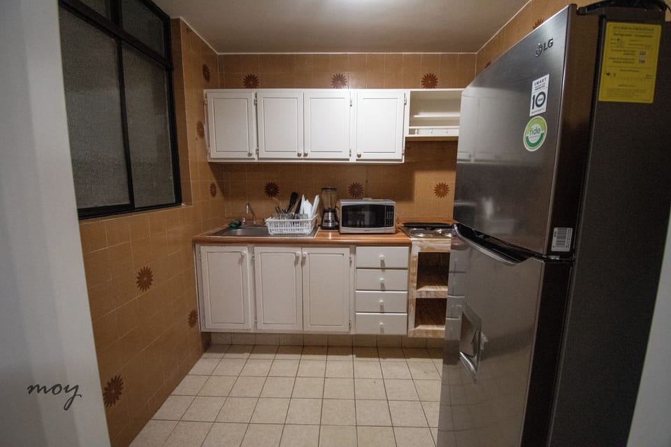 Comfort Apartment | Private kitchen | Full-size fridge, microwave, cookware/dishes/utensils