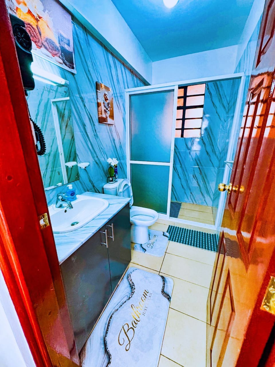 Rainfall shower, designer tiles, and fluffy cotton towels – your daily reset)