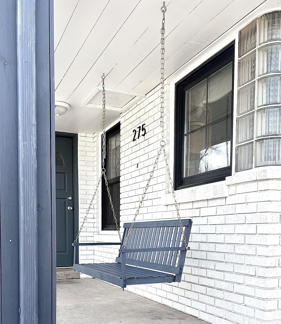 Relax on the porch swing and watch all the main street happenings