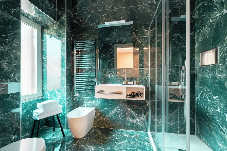 Superior Double Room, City View | Bathroom | Shower, designer toiletries, hair dryer, slippers