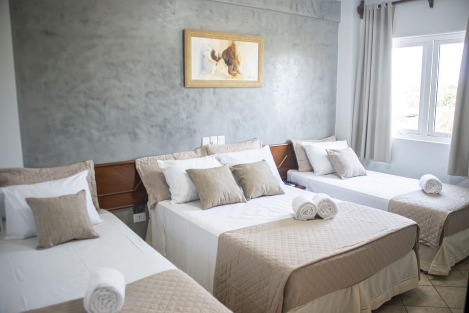 Standard Quadruple Room | In-room safe, desk, laptop workspace, soundproofing