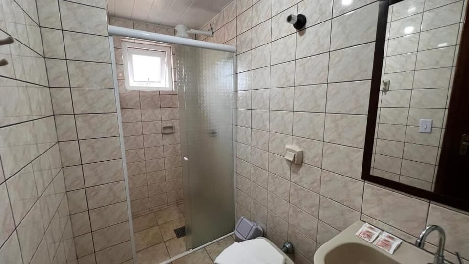 Shower, towels, soap, toilet paper