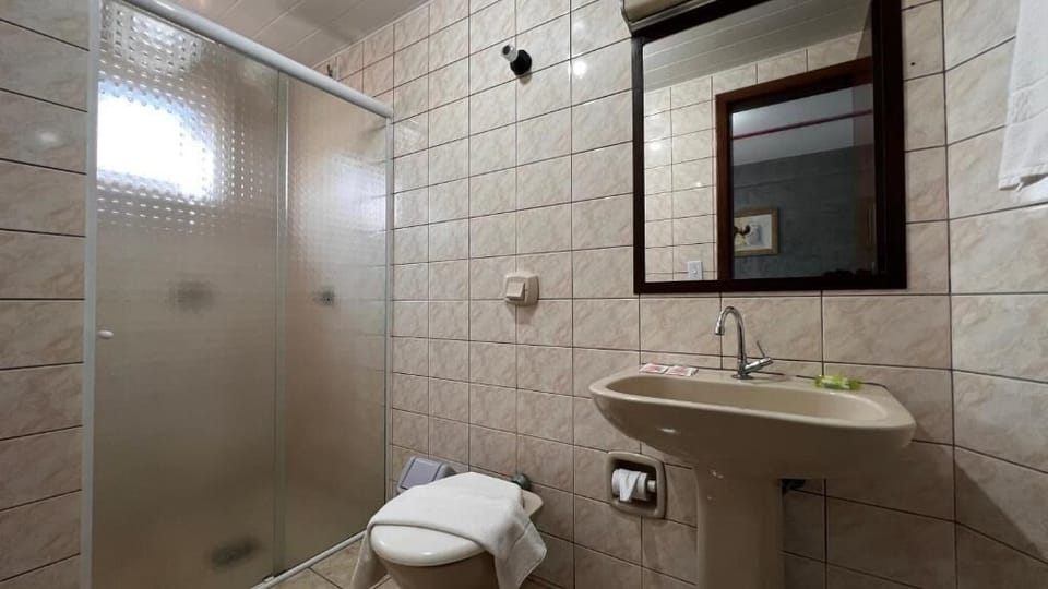 Shower, towels, soap, toilet paper