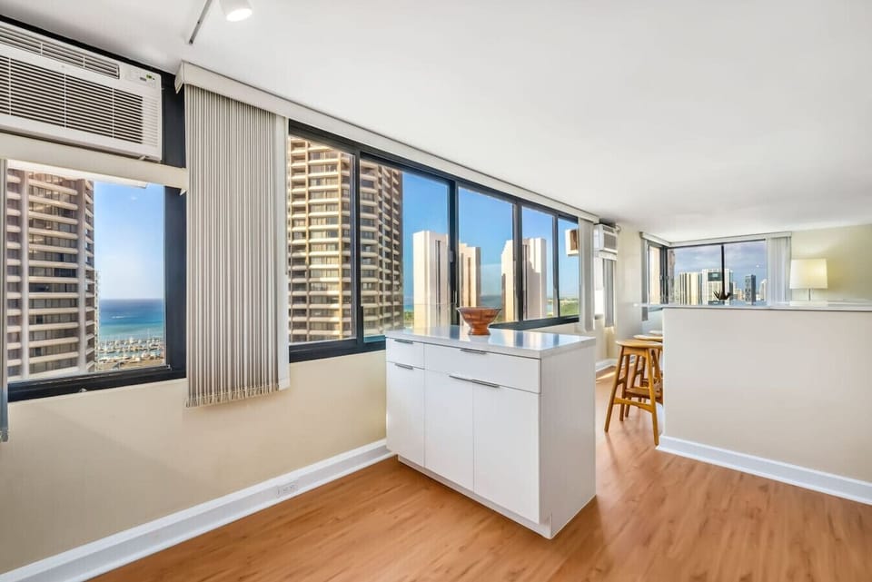 Prepare your favorite meals in the fully equipped kitchen, featuring a spacious kitchen island. Perfect for meal prepping with a view!