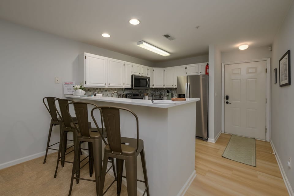 Functional kitchen layout with breakfast bar seating