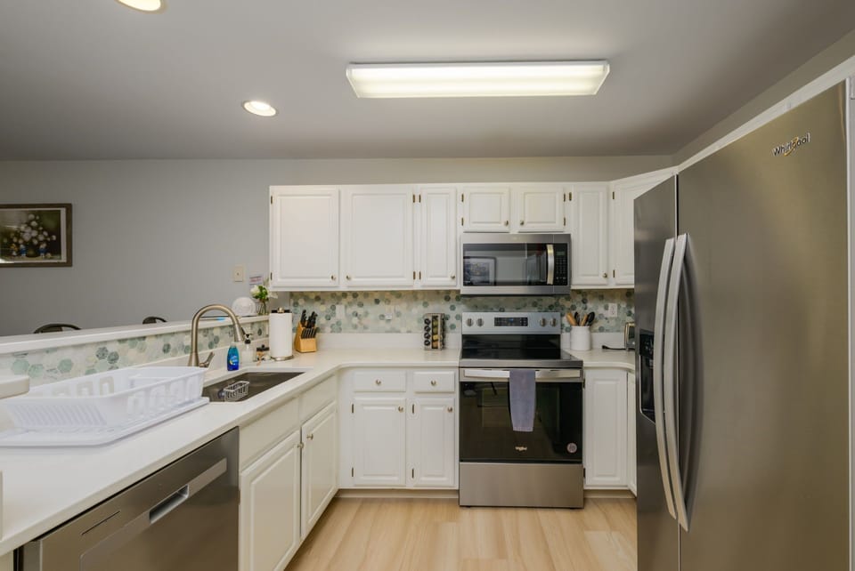 Spacious kitchen stocked for cooking meals during your stay