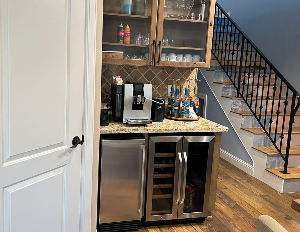 Coffee bar, beverage fridg, ice maker. Espresso cups, coffee mugs for 14