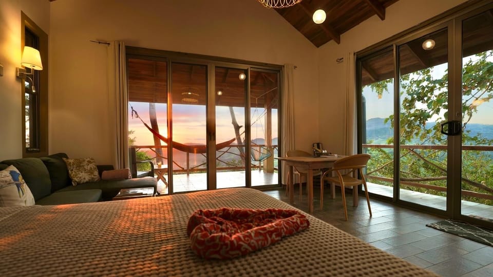 Lovely sunsets and ample views of nature from your bed, sofa and dining table!