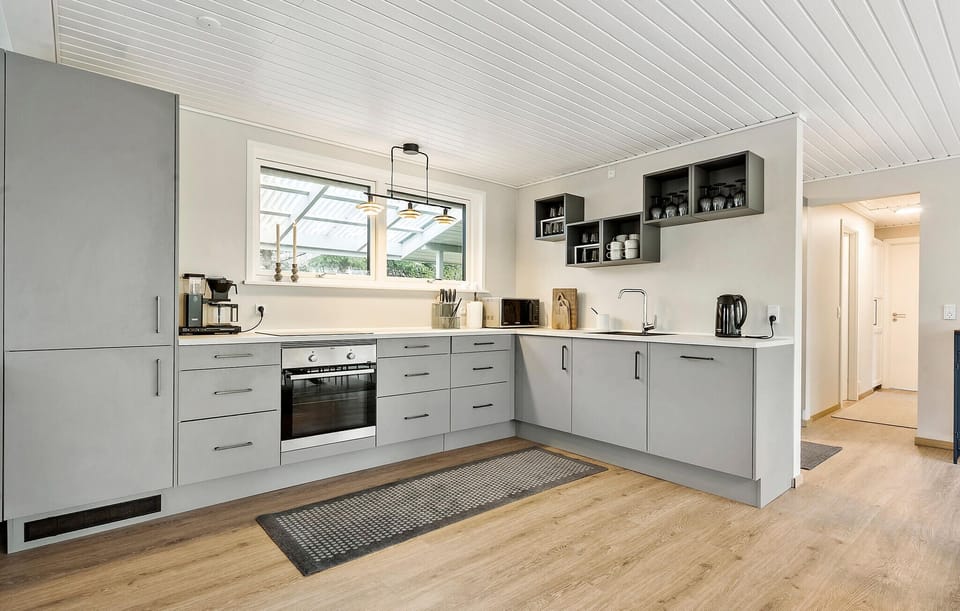 Fridge, stovetop, dishwasher, coffee/tea maker