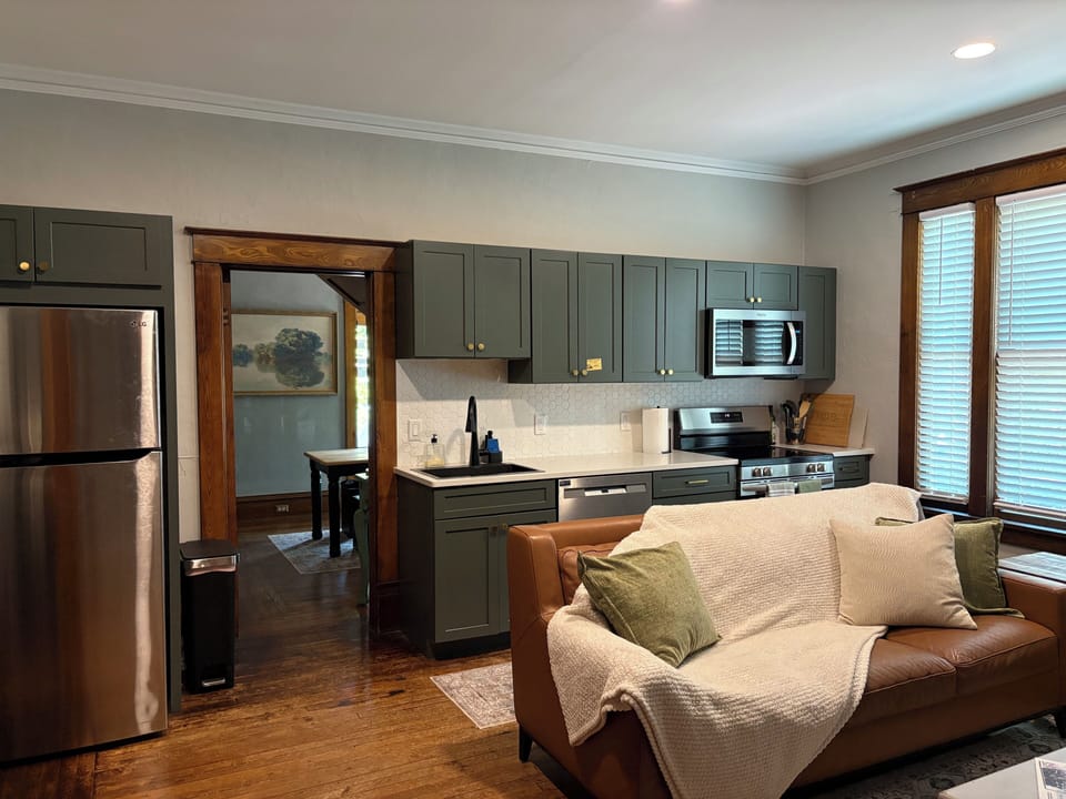 Kitchen with stove, oven, dishwasher, microwave & fridge. (fully stocked)