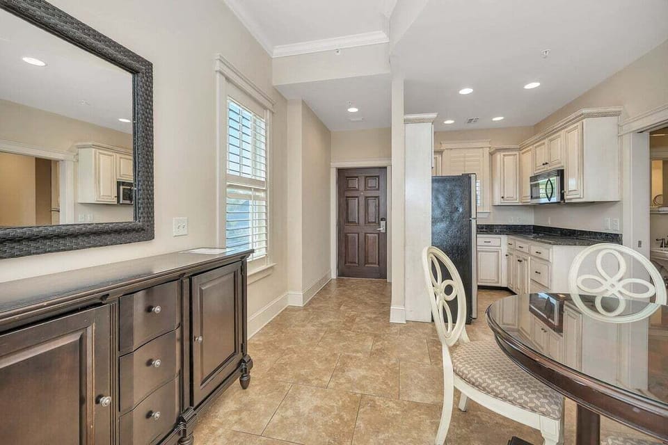 Sea Gate #208 View of Entry Hallway and Kitchen from Dining Area