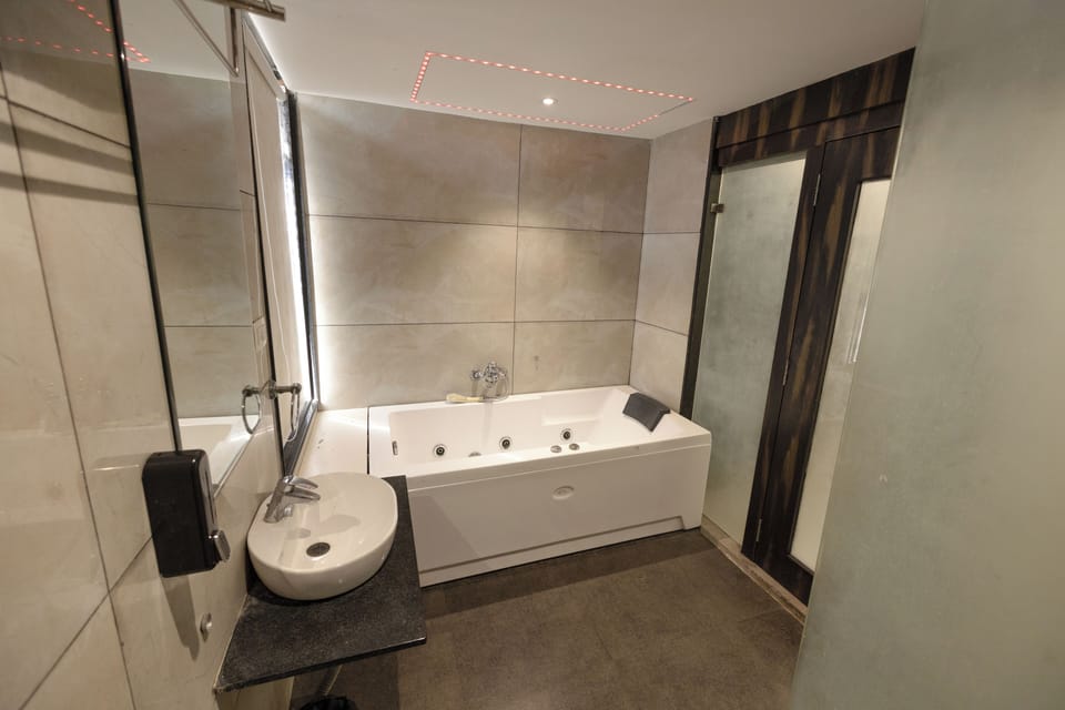 Premium Suite, City View | Bathroom | Shower, slippers, towels, soap