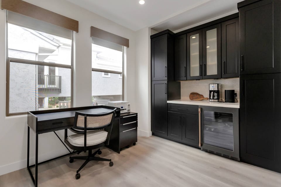 Taditional coffee maker, wine fridge, desk to work from home and much more