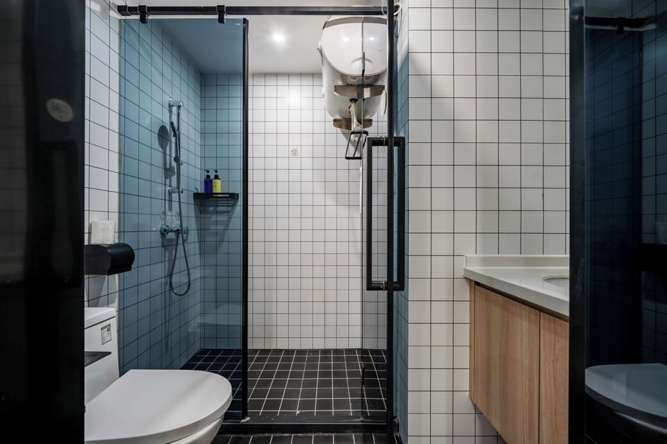 Shower, hair dryer, slippers, towels