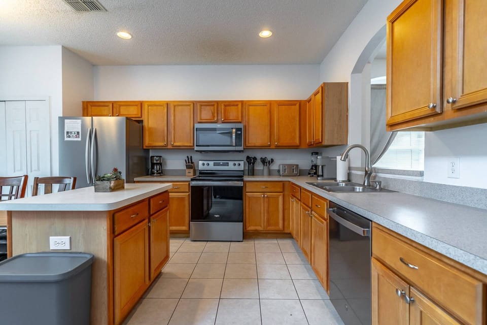 Fully stocked kitchen with stainless steel appliances