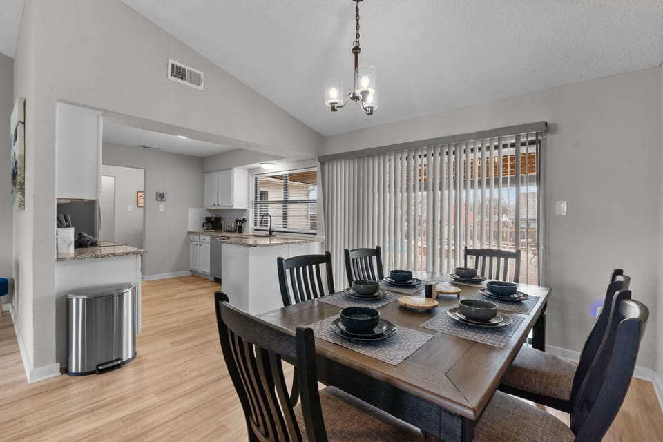 The dining area near the pool area in the backyard.