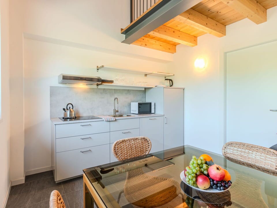 Interior Design, Flooring, Ceiling, Floor, Room, Apartment, Countertop, Wood Stain, Kitchen, Chair