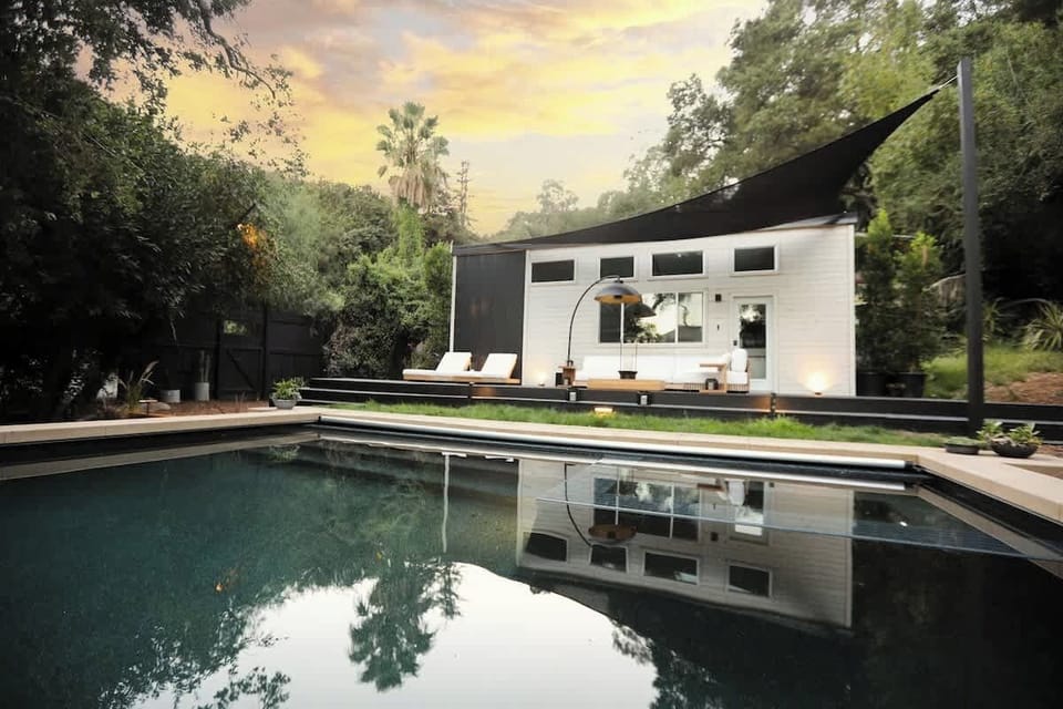 Exterior | Tiny Home, Pool & Outdoor Deck at Sunset