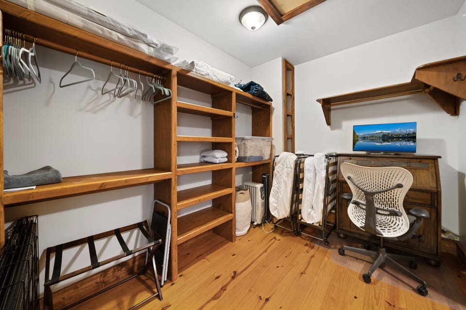 Inside Huge Walk-in Closet in the Master Suite, has "hidden" office and Twin Roll Aways Beds