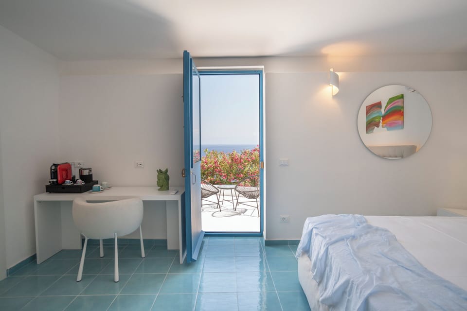 Deluxe Room, Sea View | In-room safe, desk, blackout drapes, soundproofing