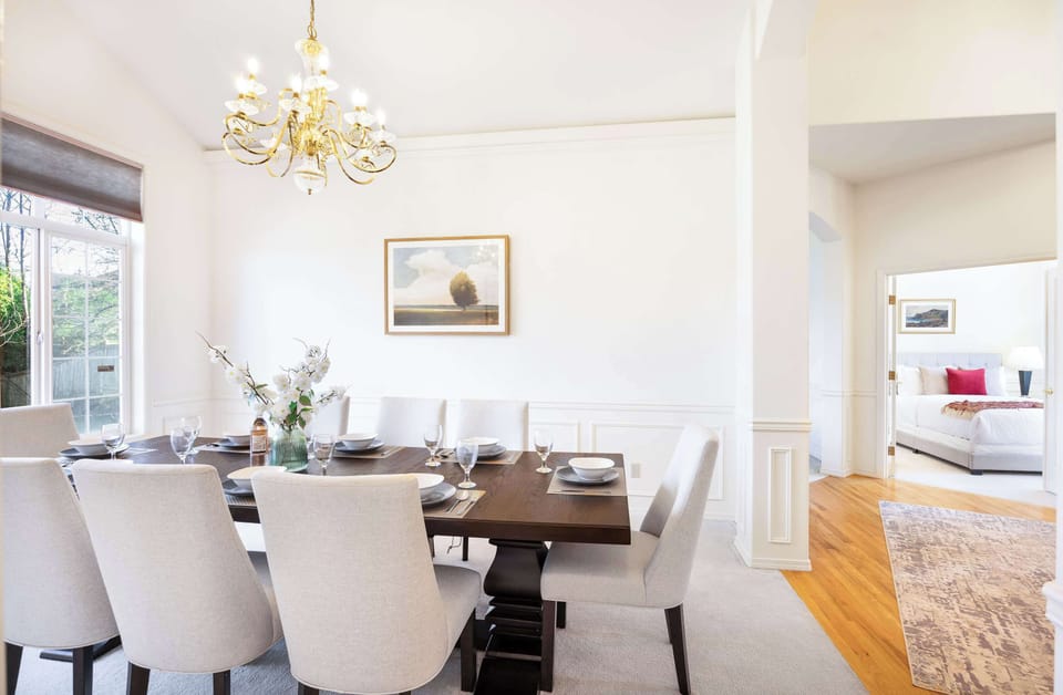 A beautifully designed dining area with a cozy yet sophisticated feel, offering a seamless flow into the master suite.