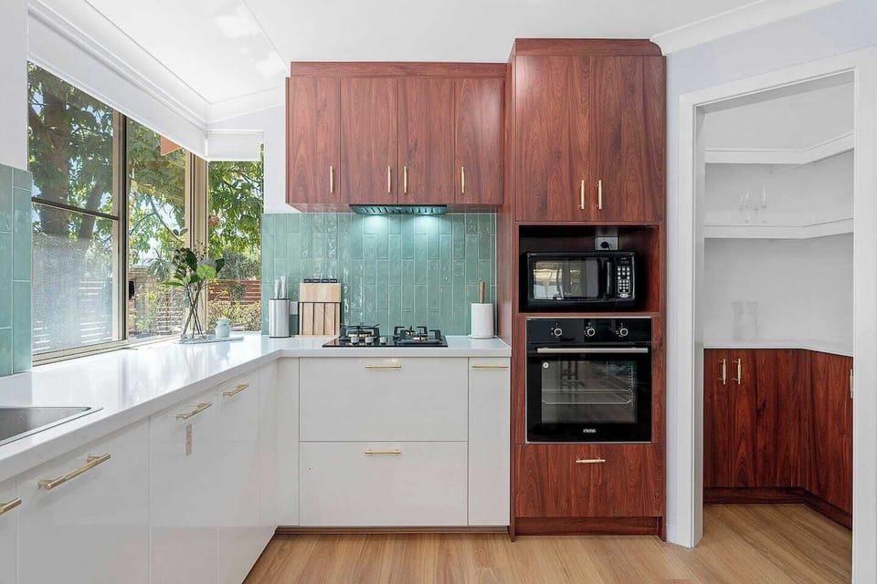 A well-organized pantry and top-of-the-line appliances make meal prep effortless and enjoyable.