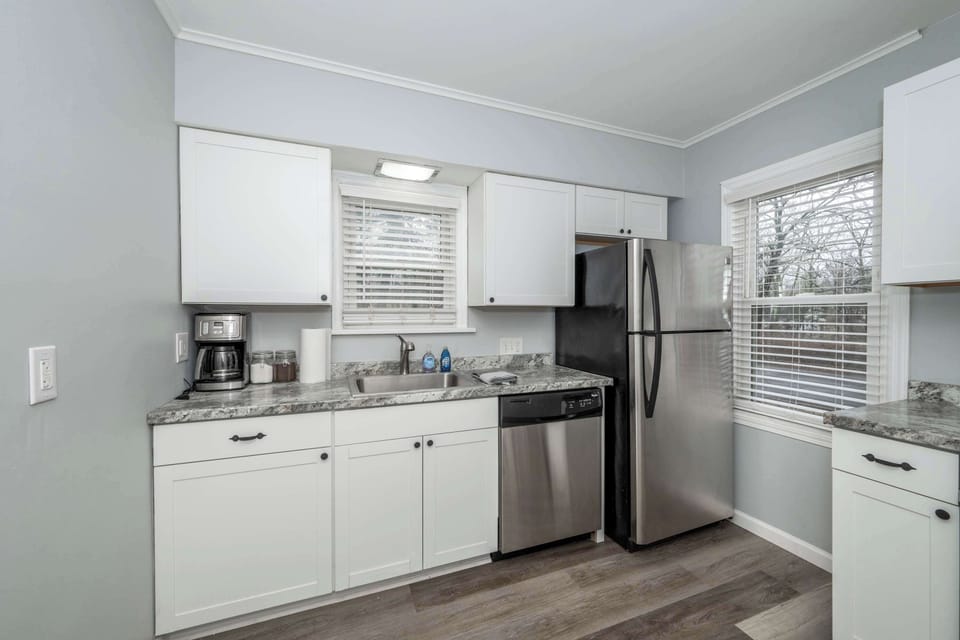 Apartment 1’s sleek kitchen offers ample space & all the comforts of home