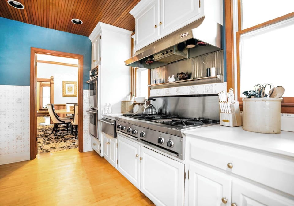 The country chic kitchen boasts ample space & every home comfort