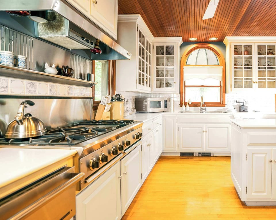 The country chic kitchen boasts ample space & every home comfort