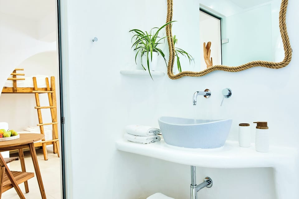 Superior Quadruple Room, Garden View | Bathroom | Shower, hair dryer, slippers, towels