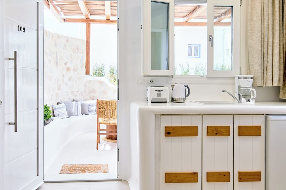 Superior Quadruple Room, Garden View | Private kitchen | Mini-fridge, highchair