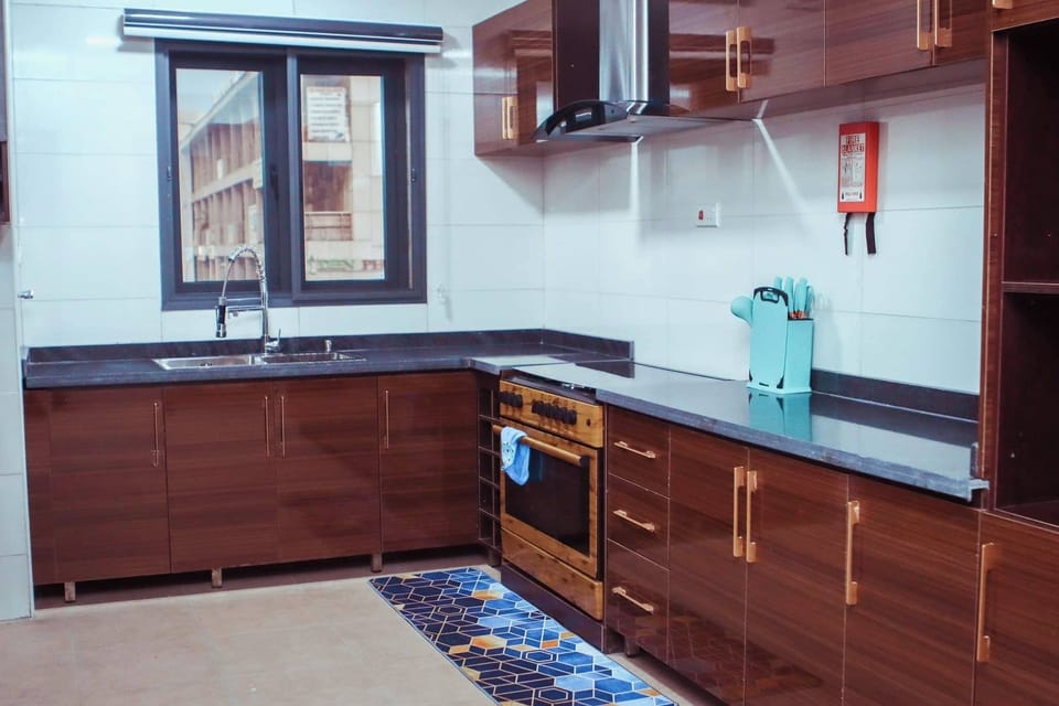 Business Apartment, Balcony, City View | Private kitchen | Fridge, microwave, oven, stovetop
