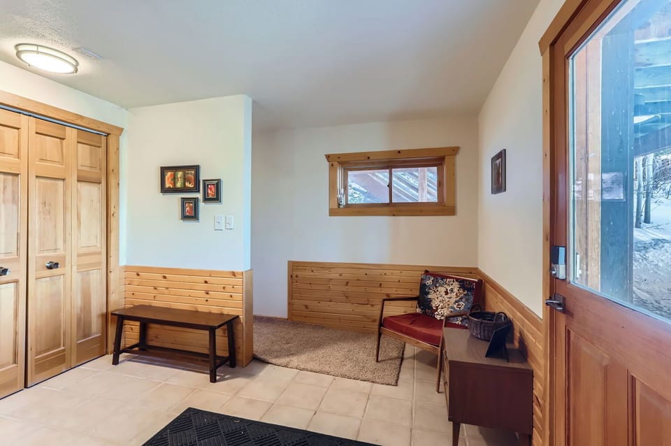 Welcoming Entrance - Ground Floor Entryway Leading to the Garage and Main Floor Stairs