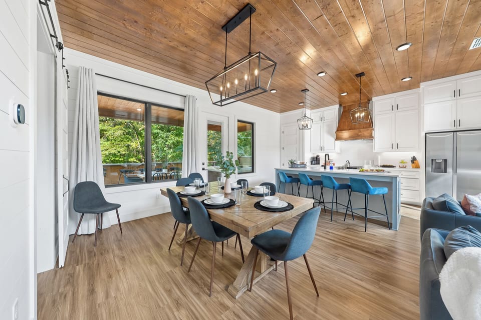 A cheerful breakfast bar with cozy stools and forest views. Perfect for quick bites, planning hikes, and coffee refills.
