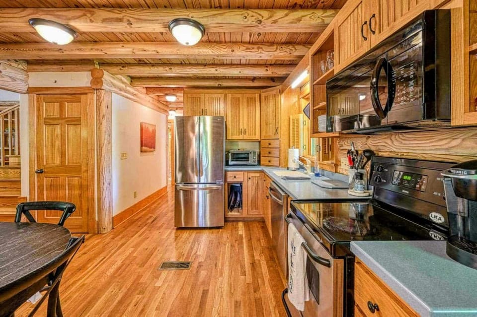 Step into this spacious kitchen, fully stocked with everything you need to prepare your favorite meals while surrounded by the warmth of natural wood accents.